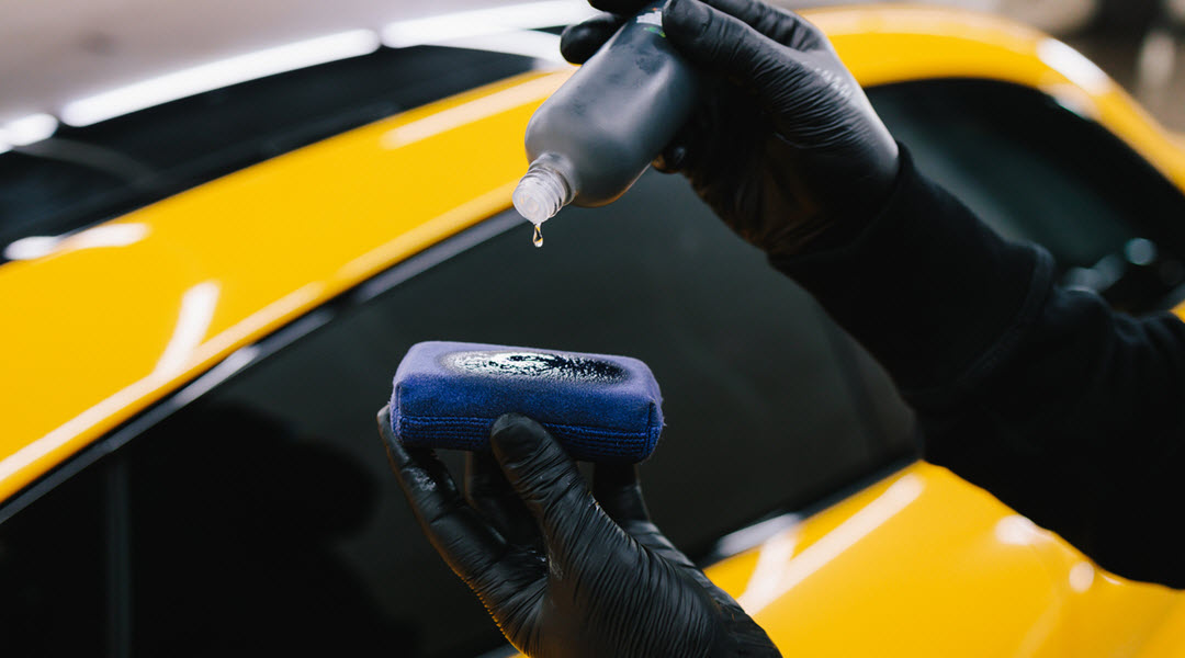 Car Detailing Professional Applying Ceramic Coating