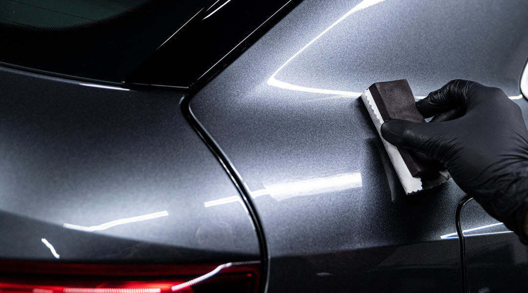 Car Detailing Worker Applying Ceramic Coating