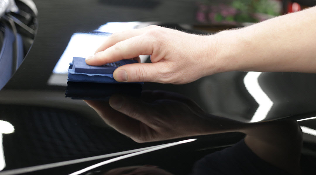 Worker Applying Ceramic Coating on Car